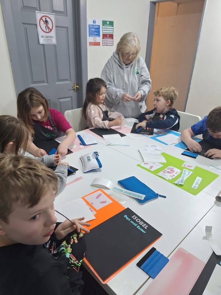 Young Crafters working on colourful paper projects at the Hub